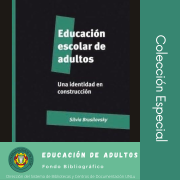 imagen de portada del libro "Educación escolar de adultos" (letras blancas sobre fondo negro)